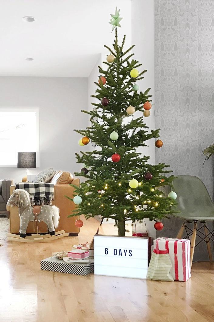<p>For an eye-catching statement, place a lightbox underneath the tree (until it's time for presents, of course) to count down the days until Christmas. </p>