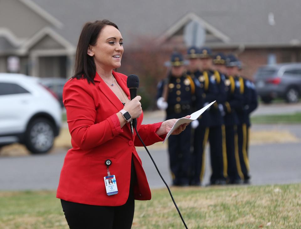 Stacy Goss, Community Liaison for Hospice & HomeCare of Reno County, begins the dedication ceremony honoring veterans Wednesday afternoon, Nov. 10, 2021, at Hospice House. 