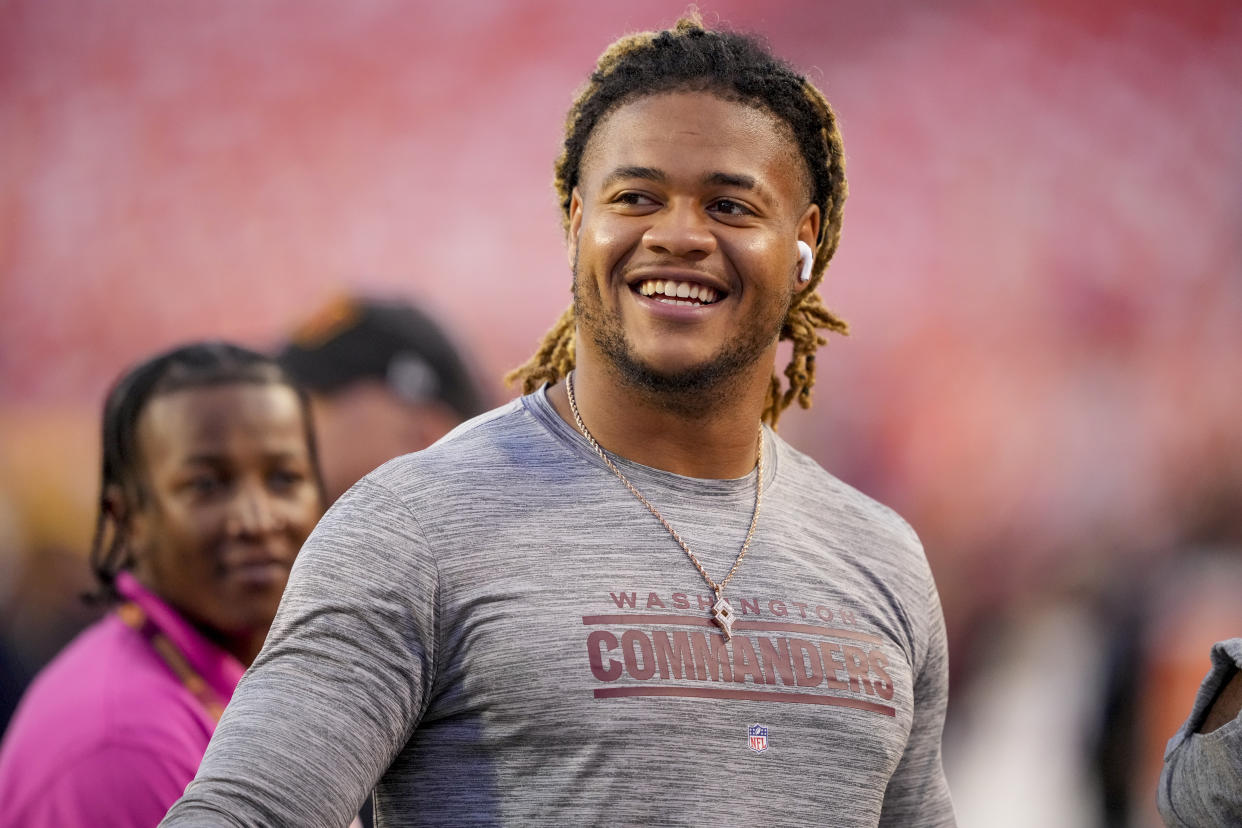 Washington Commanders defensive end Chase Young warms up before an NFL football game against the Chicago Bears, Thursday, Oct. 5, 2023, in Landover, Md. (AP Photo/Andrew Harnik)