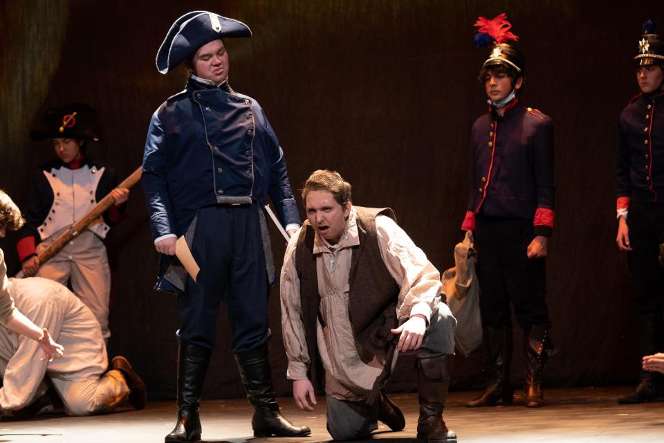 Oden Berthelsen as Inspector Javert reluctantly grants Jeremy Szymanski as Jean Valjean his parole in the opening scene from "Les Miserables (School Edition)" at the Croswell Opera House.