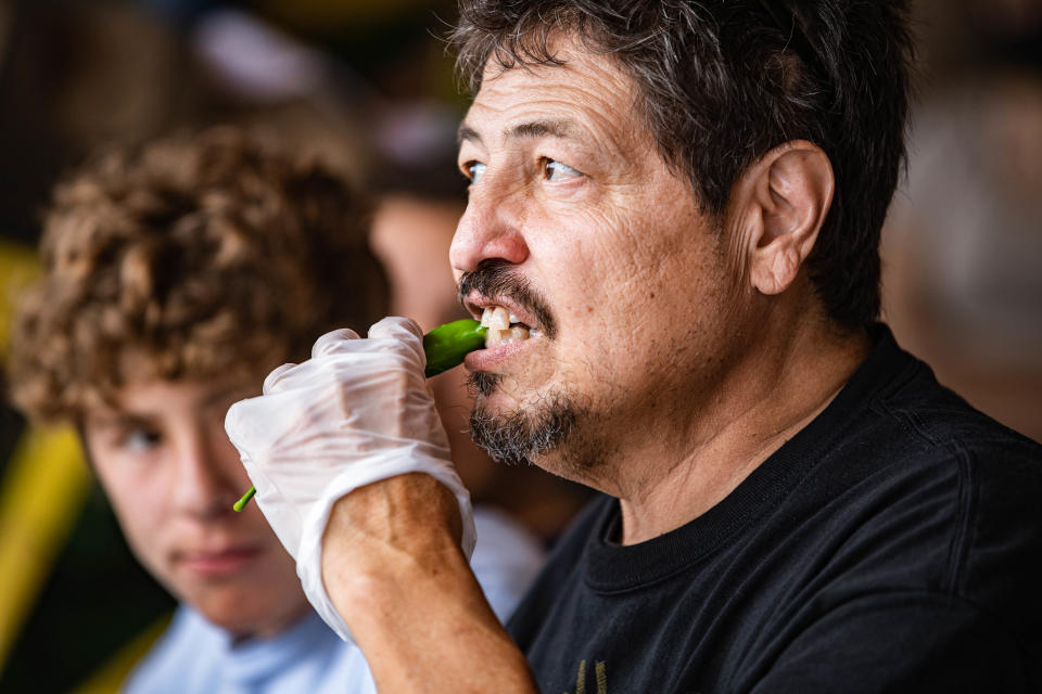 Gary Bock competes in a chile eating competition at the annual Hatch Chile Festival in Hatch on Saturday, Sept. 4, 2021.