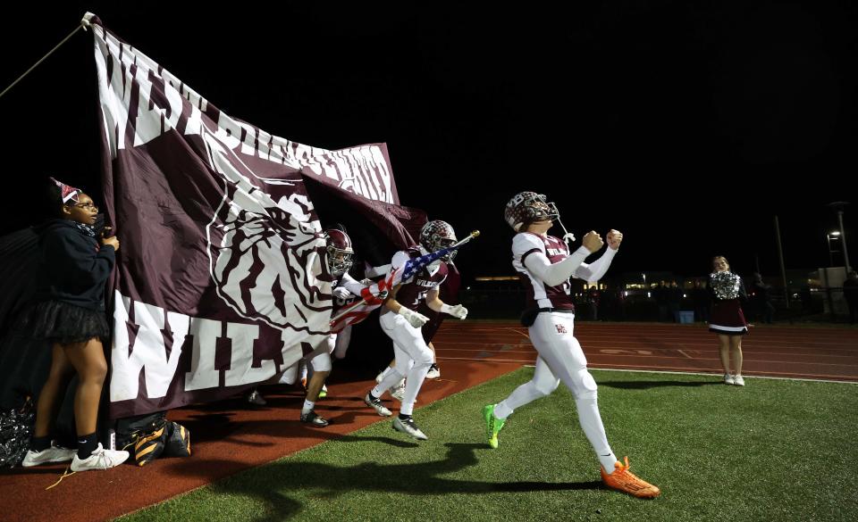 West Bridgewater co-captain James Harris leads the team onto the field before a game versus Amesbury on Friday, Nov. 10, 2023.