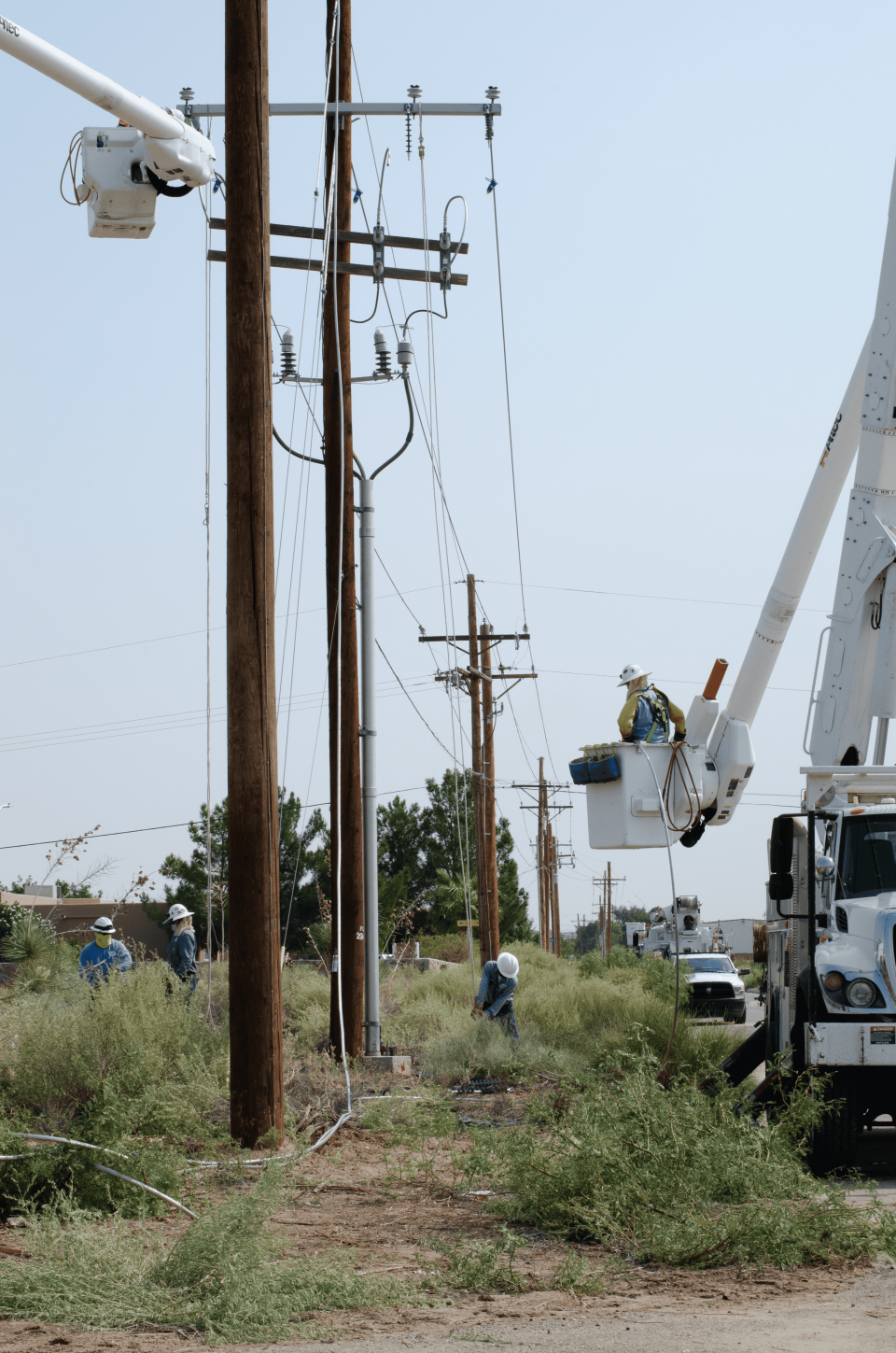 El Paso Electric crews on Monday, Aug. 24, 2020, fix power lines and poles damaged in a storm the night before. A power outage impacted thousands of customers in Las Cruces and Doña Ana.