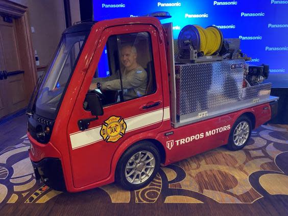 Journalist David Phelan tries out the miniature fire engine (The Independent)