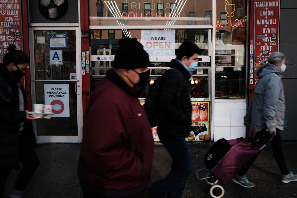 NEW YORK, NY - FEBRUARY 05: People walk through a Manhattan neighborhood on February 05, 2021 in New York City. New government jobs numbers released on Friday showed that while 49,000 jobs were added in January, the United States economy is still down nearly 10 million jobs lost since before the pandemic. (Photo by Spencer Platt/Getty Images)