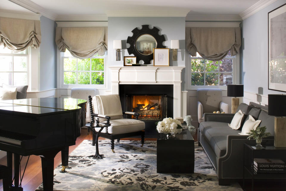 This publicity photo provided by Burnham Design shows a living room designed by Betsy Burnham that contrasts icy blue walls and white accents with shades of charcoal gray and black to create winter-inspired style that looks good during any season. (AP Photo/Burnham Design, Grey Crawford)