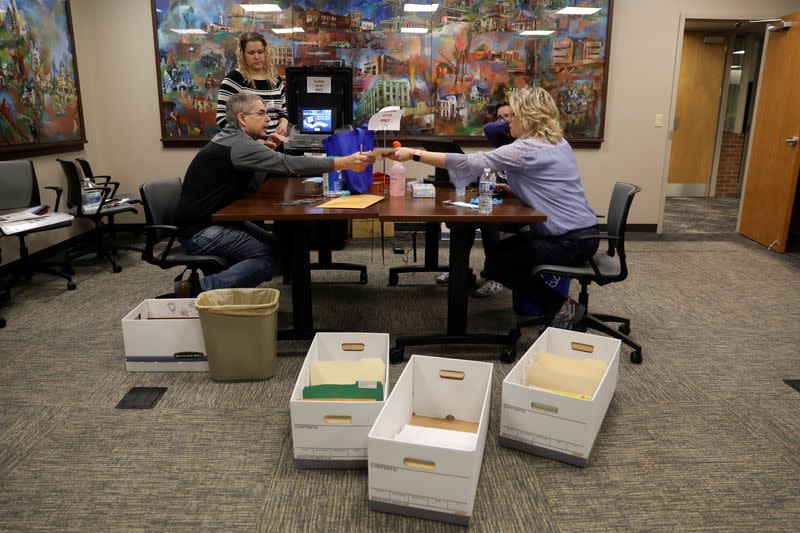 Absentee ballots are counted during the presidential primary election in Wisconsin