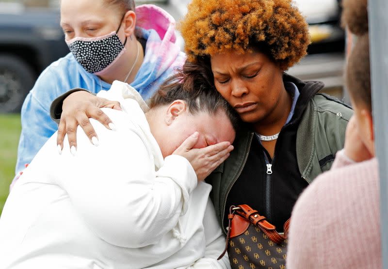 The family of Daunte Wright mourn at a vigil, days after he was fatally shot by former police officer Kim Potter at a traffic stop, in Brooklyn Center, Minnesota