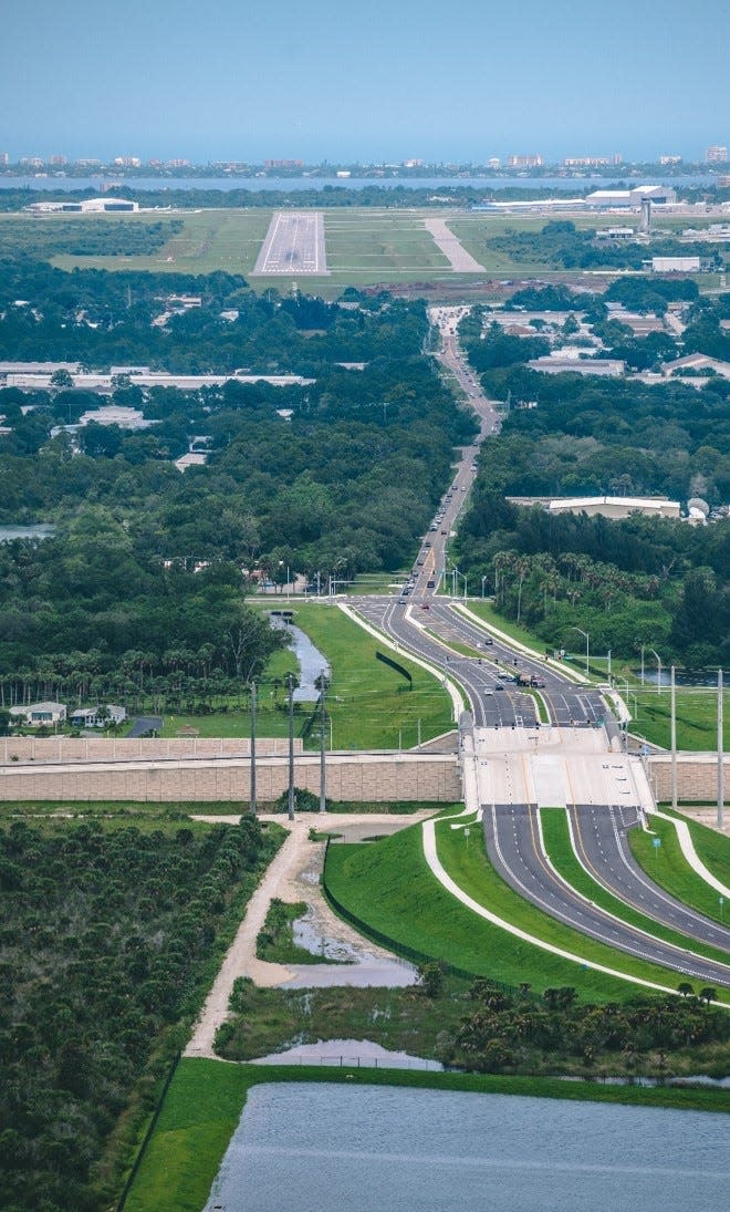 Looking east, this aerial view shows the four-lane section of Ellis Road between John Rodes Boulevard and the Interstate 95 interchange -- and the two-lane stretch of Ellis Road leading toward the Melbourne Orlando International Airport runways.