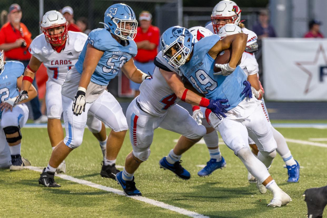 Bartlesville High's Pj Wallace powers through the defense during the Bruins' home opener against Collinsville. Wallace has rushed for more than 100 yards in two of the Bruins' first three games.