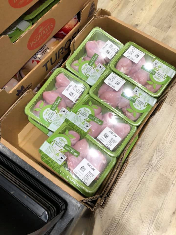 Pictured is a photo of the raw chicken inside cardboard boxes in Woolworths.