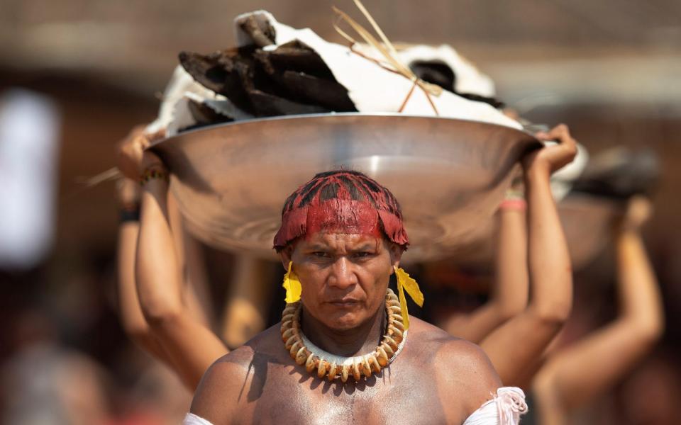 Besieged Amazon tribes grant rare access to Xingu chief’s funeral rites - UESLEI MARCELINO /REUTERS