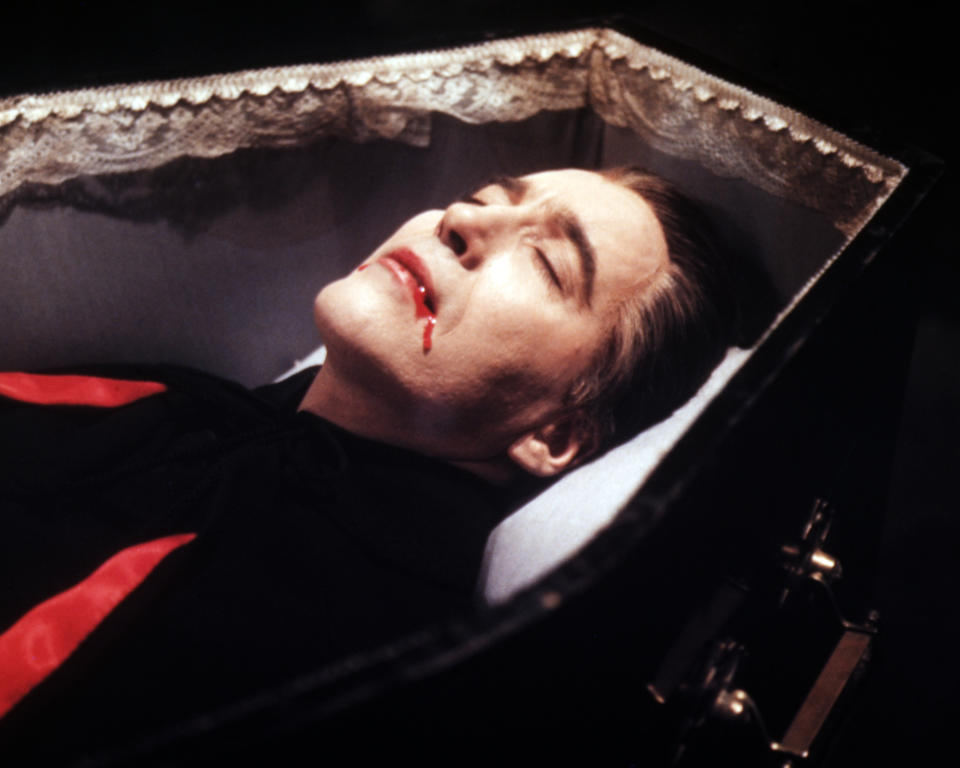 Christopher Lee, British actor, blood trickling from his mouth as lays in a coffin in a publicity still issued for the film, 'Dracula', 1958. The Hammer horror film, directed by Terence Fisher (1904-1980), starred Lee as 'Count Dracula'. (Photo by Silver Screen Collection/Getty Images)