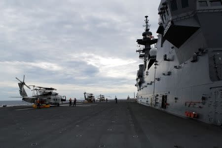 Japan Maritime Self-Defense Force (JMSDF) SH-60 Seahawk helicopters are seen on the flight deck of JMSDF's helicopter carrier Izumo during a military exercise in South China Sea, near Singapore, June 20, 2017. REUTERS/Nobuhiro Kubo