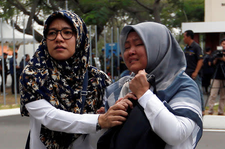 Relatives of passengers of Lion Air flight JT610 that crashed into the sea arrive at Soekarno Hatta International airport near Jakarta, Indonesia, October 29, 2018. REUTERS/Willy Kurniawan