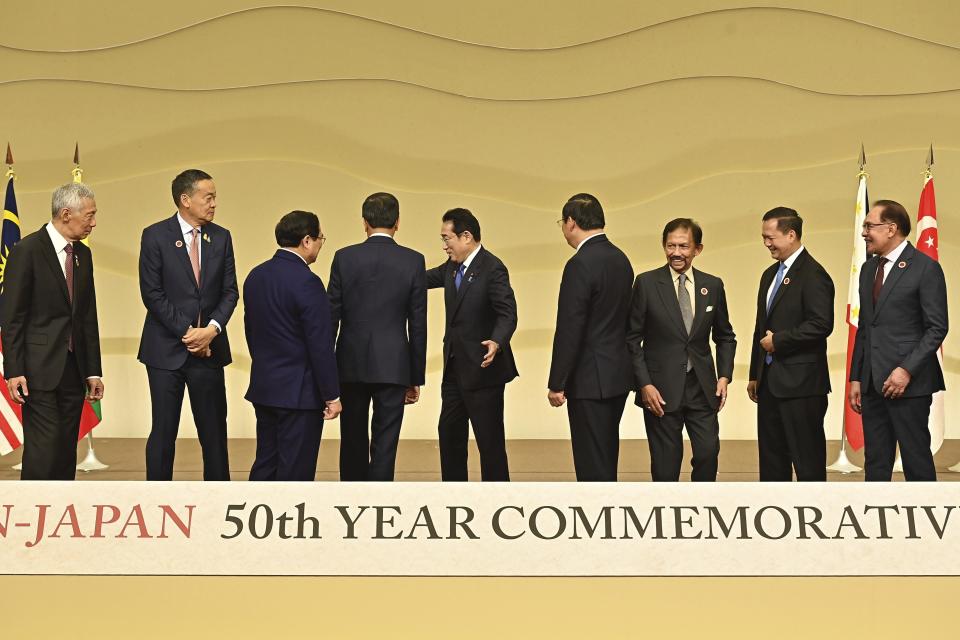 Leaders of ASEAN nations, from left, Singapore's Prime Minister Lee Hsien Loong, Thailand Prime Minister Srettha Thavisin, Vietnam's Prime Minister Pham Minh Chinh, Indonesian President Joko Widodo, Japanese Prime Minister Fumio Kishida, Laos's Prime Minister Sonexay Siphandone, Brunei's Sultan Hassanal Bolkiah, Cambodia's Prime Minister Hun Manet and Malaysia's Prime Minister Anwar Ibrahim prepare for a group photo prior to their talks session during ASEAN-Japan 50th Year Commemorative Summit in Tokyo Sunday, Dec. 17, 2023. (David Mareuil/Pool Photo via AP)