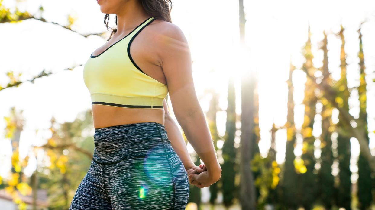 woman stretching in the perfect sports bra