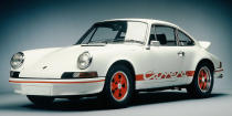<p>For the last 30 years, the 911 Carrera has been the most basic 911 you could buy, but in 1973, that word denoted something special. The <a rel="nofollow noopener" href="http://www.roadandtrack.com/car-culture/videos/a28861/seen-through-glass-porsche-911-gt3-carrera-rs/" target="_blank" data-ylk="slk:Carrera RS 2.7;elm:context_link;itc:0;sec:content-canvas" class="link ">Carrera RS 2.7</a> was lighter, more powerful, and rarer than other 911s of the era, and are now considered the pinnacle of classic 911s.</p>