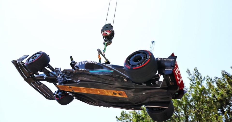 Mercedes' Lewis Hamilton's car is craned away at the 2023 Monaco Grand Prix. Monte Carlo, May 2023. Credit: Alamy