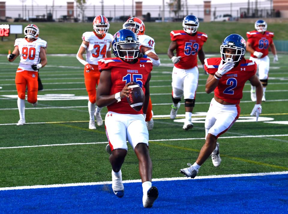 Cooper quarterback Chris Warren scrambles for a touchdown against San Angelo Central during Friday's game at Shotwell Stadium