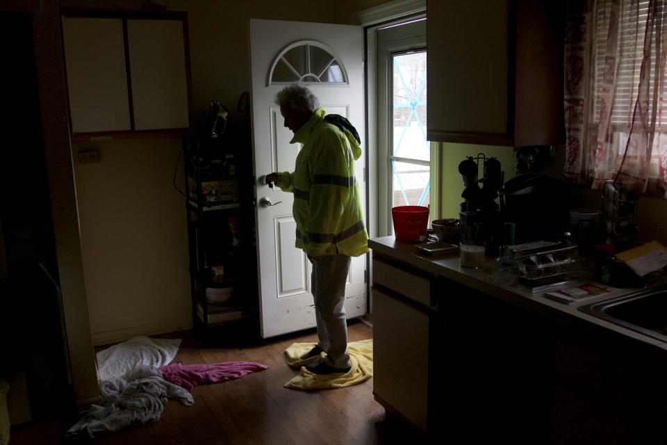 Carol Mason mops her flooded floor with towels after returning to her home in Atlantic City, N.J., Tuesday, Oct. 30, 2012. Many homeowners who suffered losses because of flooding from Hurricane Sandy are likely to find themselves out of luck. Standard homeowners policies don't cover flooding damage, and the vast majority of homeowners don't have flood insurance. Yet it's likely that many Northeasterners will purchase it in coming months, hoping they'll be covered the next time around, at a cost averaging around $600 a year. (AP Photo/Seth Wenig)