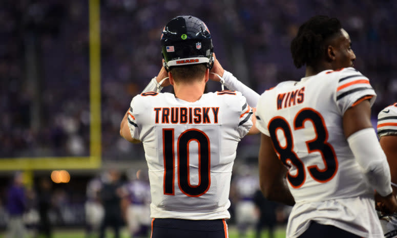 Bears QB Mitchell Trubisky putting his helmet on during a game.