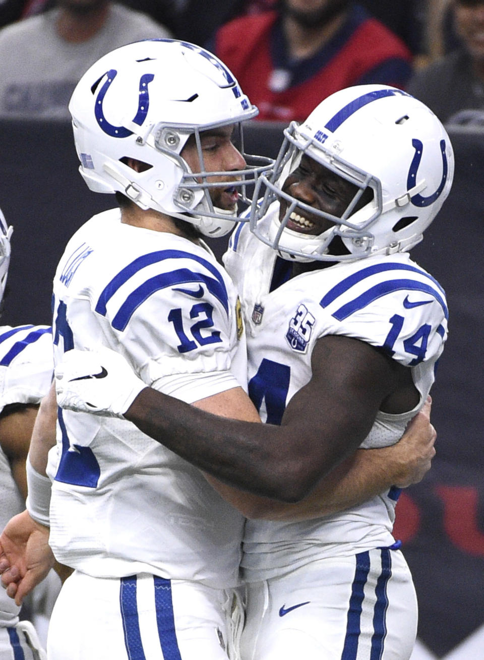 Indianapolis Colts wide receiver Zach Pascal (14) celebrates with quarterback Andrew Luck (12) after catching a pass for a touchdown against the Houston Texans during the second half of an NFL football game Sunday, Dec. 9, 2018, in Houston. (AP Photo/Eric Christian Smith)