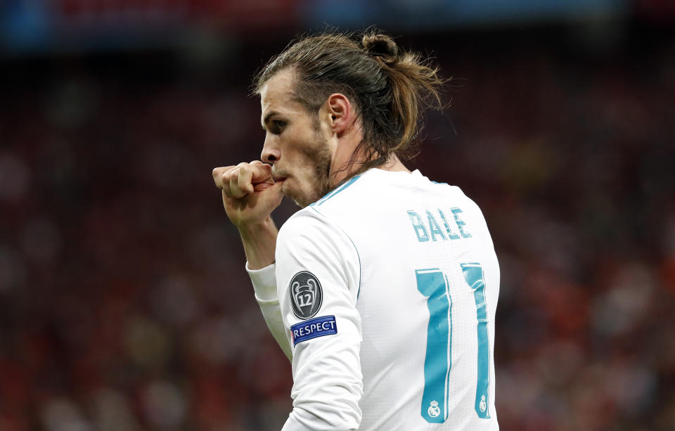 FILE - Real Madrid's Gareth Bale celebrates after scoring his side's third goal during the Champions League Final soccer match between Real Madrid and Liverpool at the Olimpiyskiy Stadium in Kiev, Ukraine, Saturday, May 26, 2018. (AP Photo/Pavel Golovkin, File)