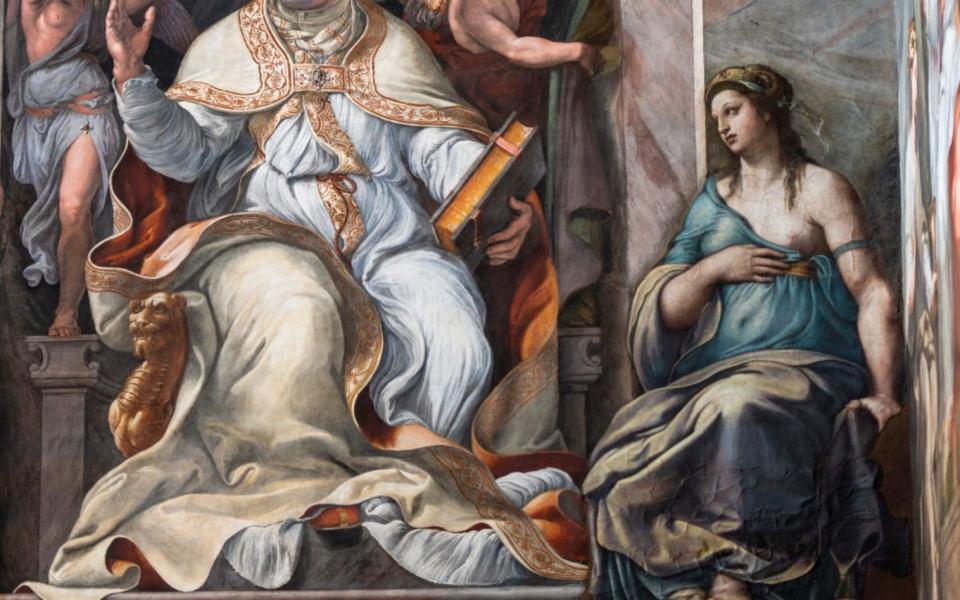 Raphael's feminine figure, 'Allegory of Friendship', right, is seen as part of a fresco depicting Pope Clemens I in the Constantine Hall at the Vatican Museums - AP