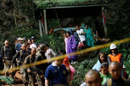 Family members and soldiers are seen near the Tham Luang cave complex during a search for members of an under-16 soccer team and their coach, in the northern province of Chiang Rai, Thailand, June 27, 2018. REUTERS/Soe Zeya Tun