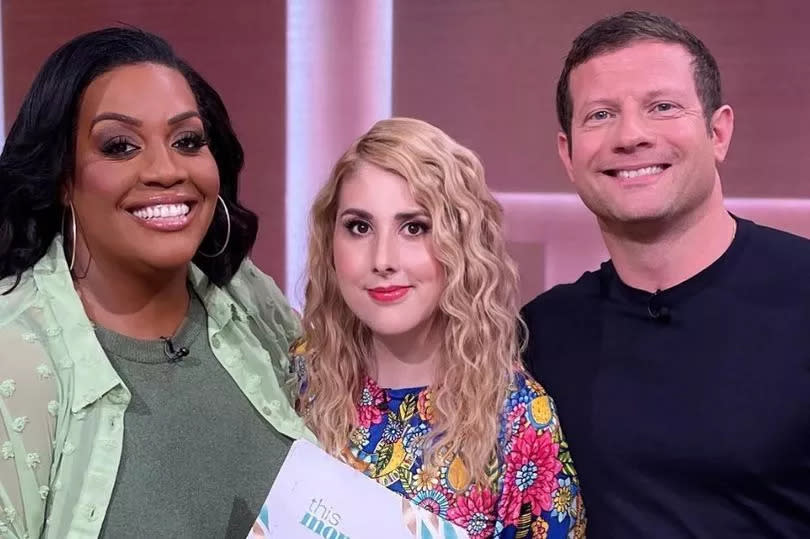 Holly is seen with This Morning presenters, Dermot O'Leary and Alison Hammond