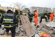<p>Rescue workers search at the site of an explosion in Ningbo, China’s eastern Zhejiang province on Nov. 26, 2017. (Photo: STR/AFP/Getty Images) </p>
