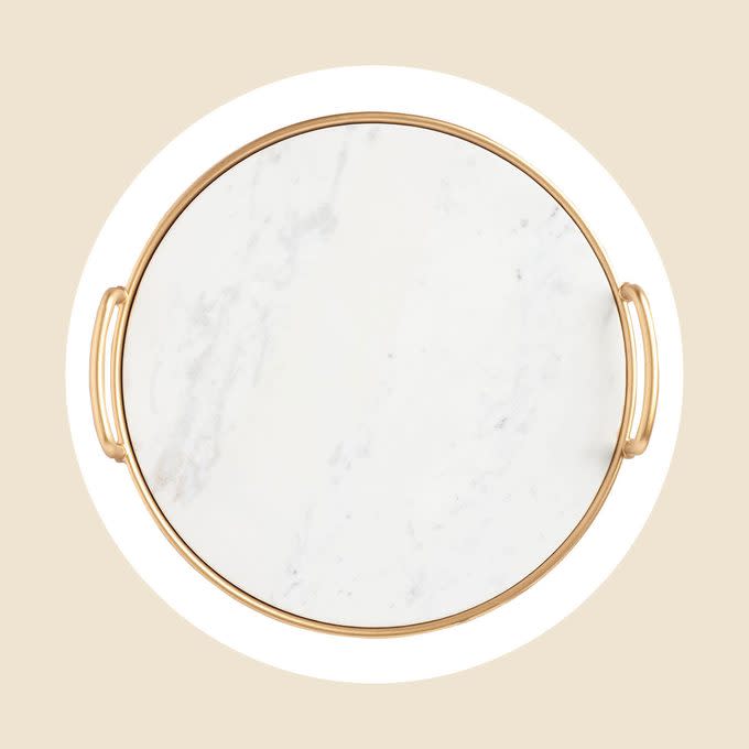 <a href="https://www.worldmarket.com/product/marble-and-gold-tray.do" rel="nofollow noopener" target="_blank" data-ylk="slk:Marble Serving Tray;elm:context_link;itc:0;sec:content-canvas" class="link rapid-noclick-resp">Marble Serving Tray</a>
