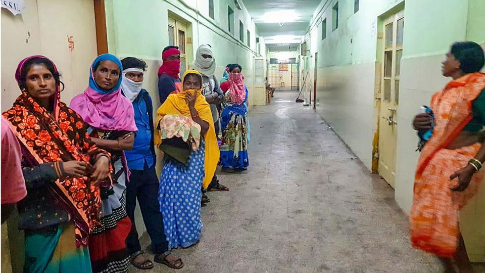 Women stand in a corridor at the Bhandara General Hospital, where a fire broke out, in Bhandara district, Saturday, 9 January, 2021. Ten infants died after a fire broke out in the special newborn care unit of hospital in the wee hours of Saturday.