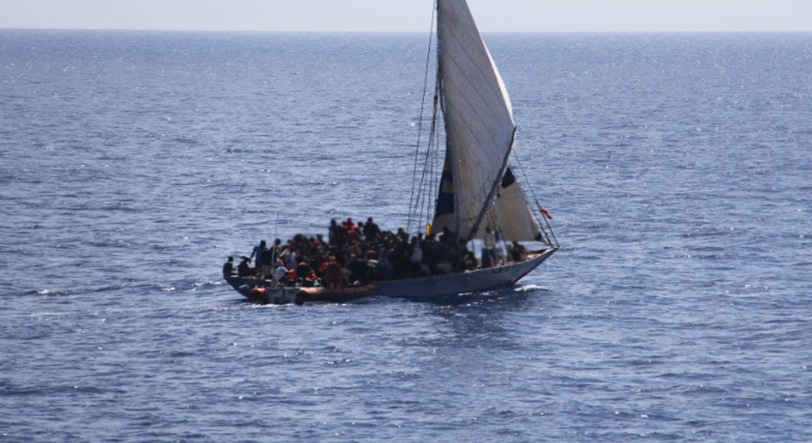 More than 140 people are packed on a Haitian migrant sailboat Sunday, March 5, 2023. The boat was stopped by the U.S. Coast Guard, and the people on board were transferred to Bahamian authorities.