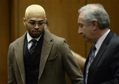 Singer Chris Brown (L) and his attorney Mark Geragos appear in court during a probation violation hearing in which his probation was revoked at Los Angeles Superior Court in Los Angeles, December 16, 2013. REUTERS/ Kevork Djansezian/Pool