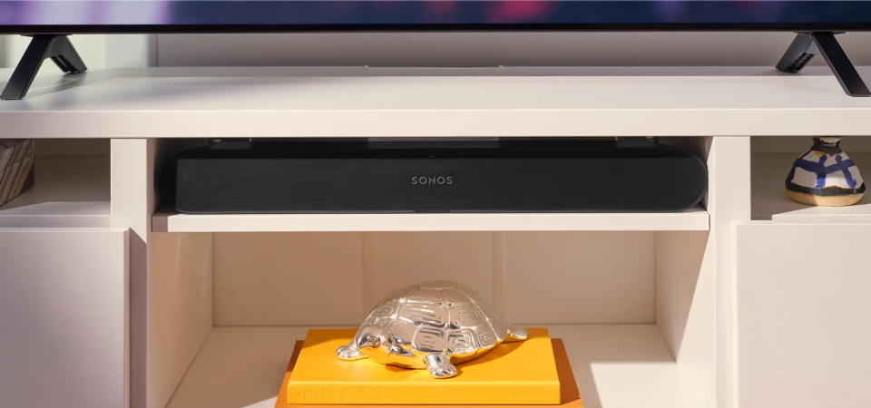 A Ray soundbar tucked into an entertainment system.