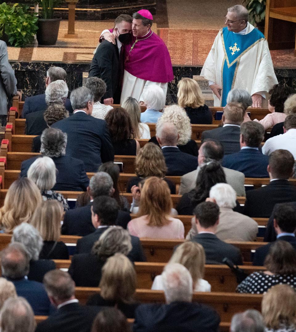 Bishop J. Mark Spalding comforts family members during the funeral Mass for the Rev. Joseph Patrick Breen at Christ the King Catholic Church Friday, May 27, 2022, in Nashville, Tenn.