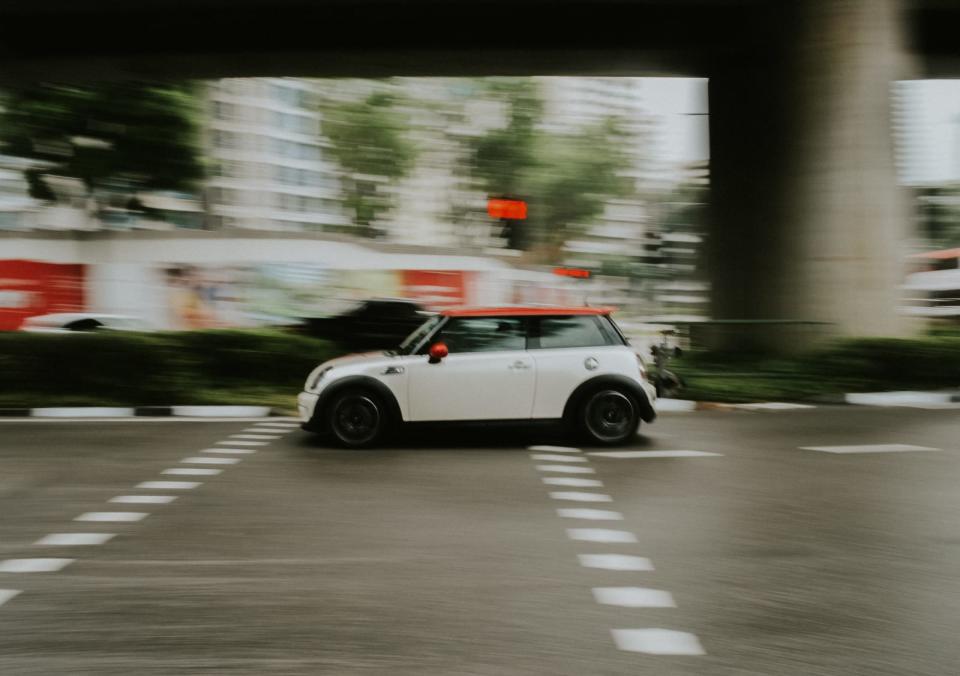 image of a car driving in Singapore at night