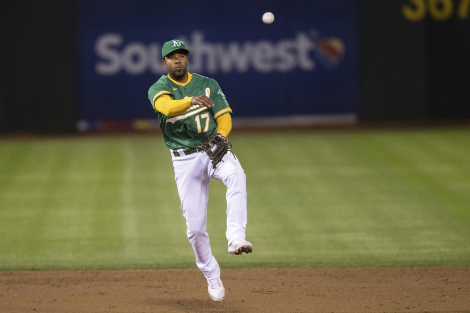 Oakland Athletics shortstop Elvis Andrus throws to first base for an out against the Los Angeles Angels during the sixth inning of a baseball game in Oakland, Calif., Monday, June 14, 2021. (AP Photo/John Hefti)