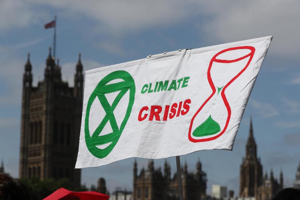 A file image of a climate change protest banner in London. A top scientist has said it's right to be scared about climate change: Jonathan Brady/PA