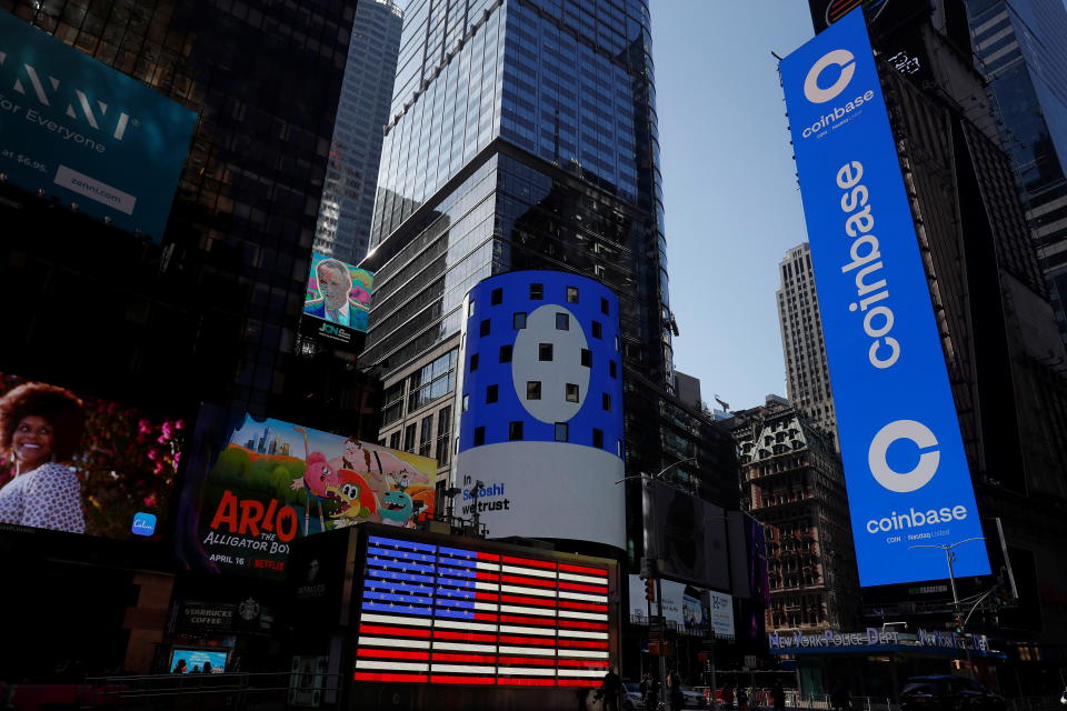 The logo of Coinbase Global Inc, the largest U.S. cryptocurrency exchange, is displayed on the Nasdaq MarketSite jumbotron and others in Times Square in New York, U.S., April 14, 2021. REUTERS/Shannon Stapleton