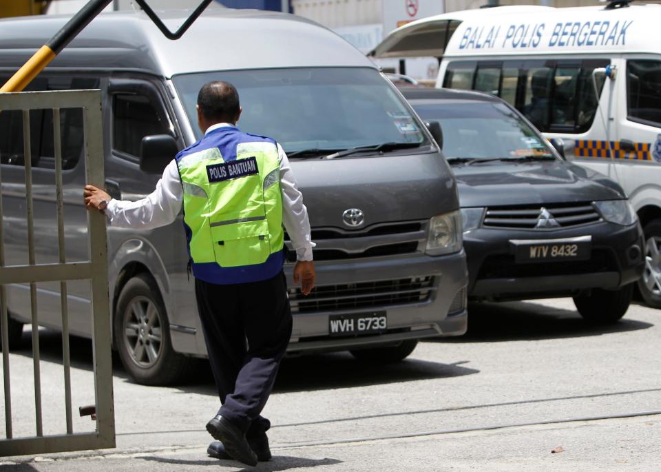 An unidentified van believed to be carrying the body of Kim Jong Nam comes out from the forensic department at Kuala Lumpur Hospital in Kuala Lumpur, Malaysia Thursday, March 30, 2017 - Credit: Daniel Chan/AP Photo