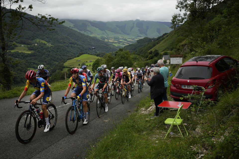 The breakaway group with Australia's Jai Hindley, center left in green shirt, climbs Soudet pass during the fifth stage of the Tour de France cycling race over 163 kilometers (101 miles) with start in Pau and finish in Laruns, France, Wednesday, July 5, 2023. (AP Photo/Daniel Cole)