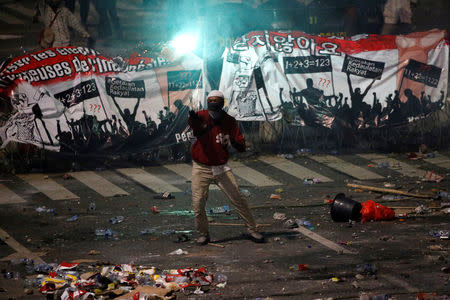 A protester gestures during a riot near the Election Supervisory Agency (Bawaslu) headquarters in Jakarta, Indonesia, May 22, 2019. REUTERS/Willy Kurniawan