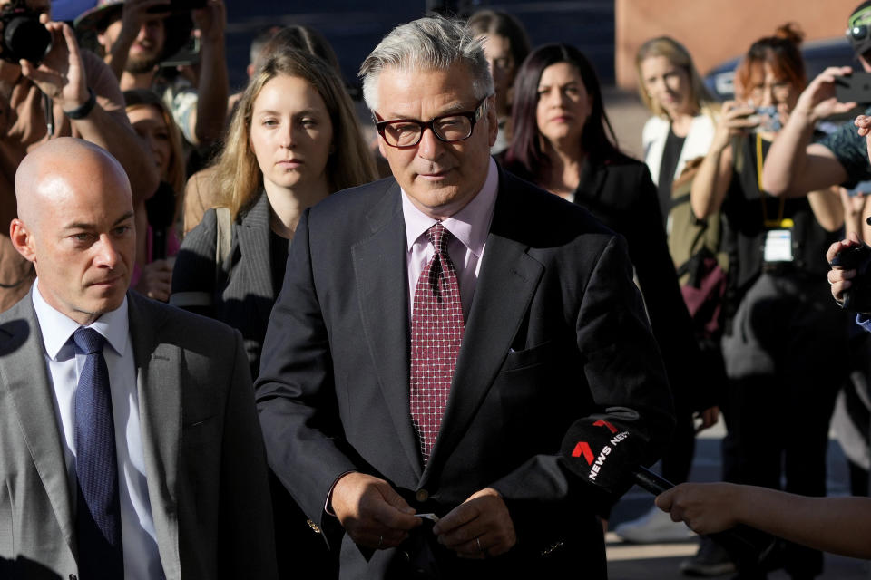 Actor Alec Baldwin arrives for his hearing in Santa Fe County District Court with attorney Luke Nikas, left, Wednesday, July 10, 2024, in Santa Fe, N.M. Baldwin is facing a single charge of involuntary manslaughter in the death of a cinematographer. (AP Photo/Ross D. Franklin)