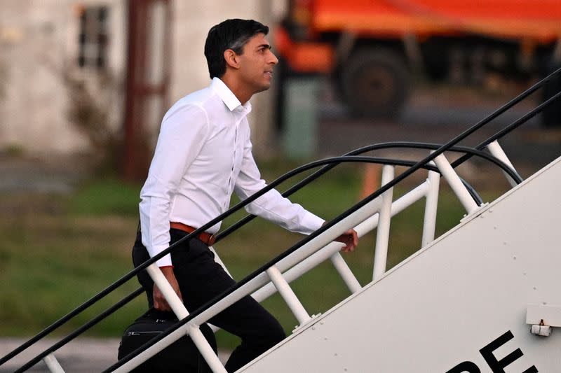 British Prime Minister Rishi Sunak boards a plane to travel to G20 meeting in Bali at Stanstead airport, London