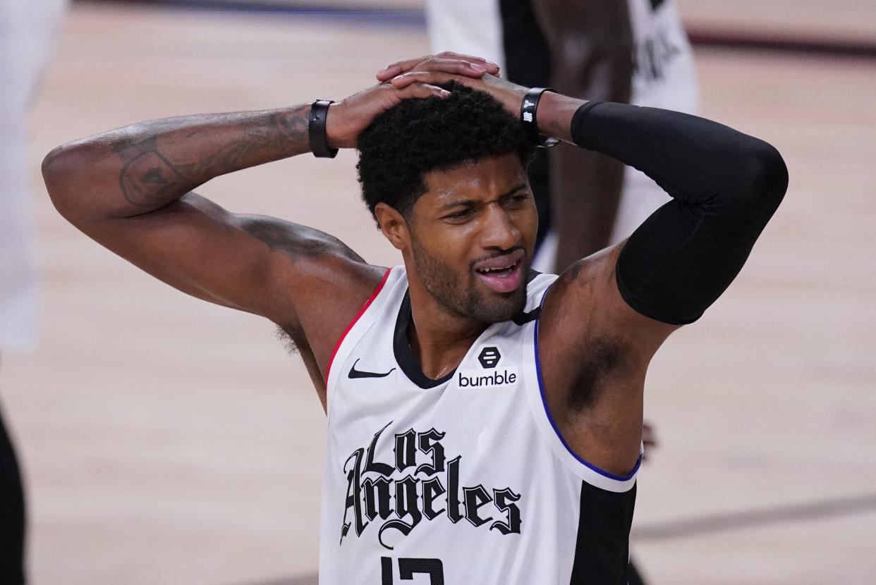 Los Angeles Clippers' Paul George (13) reacts after being called for a foul during the first half of an NBA conference semifinal playoff basketball game against the Denver Nuggets, Wednesday, Sept. 9, 2020, in Lake Buena Vista, Fla. (AP Photo/Mark J. Terrill)