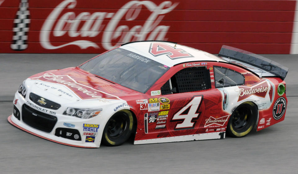 Kevin Harvick steers into Turn 1 during qualifying for a NASCAR Sprint Cup auto race at Darlington Speedway in Darlington, S.C., Friday, April 11, 2014. Harvick won the pole position for Saturday's race. (AP Photo/Mike McCarn)