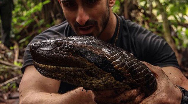 Rosolie says he participated in the risky act in order to raise awareness of the anaconda's habitat, which is being demolished by mining. Photo: Supplied